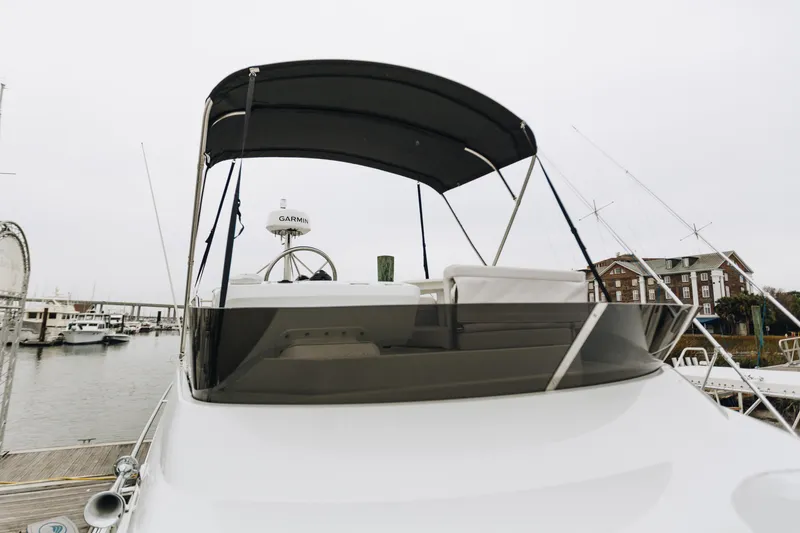 Slide: The Image of 2026 Beneteau Antares 11 Fly yacht with flybridge, docked at marina. - 5