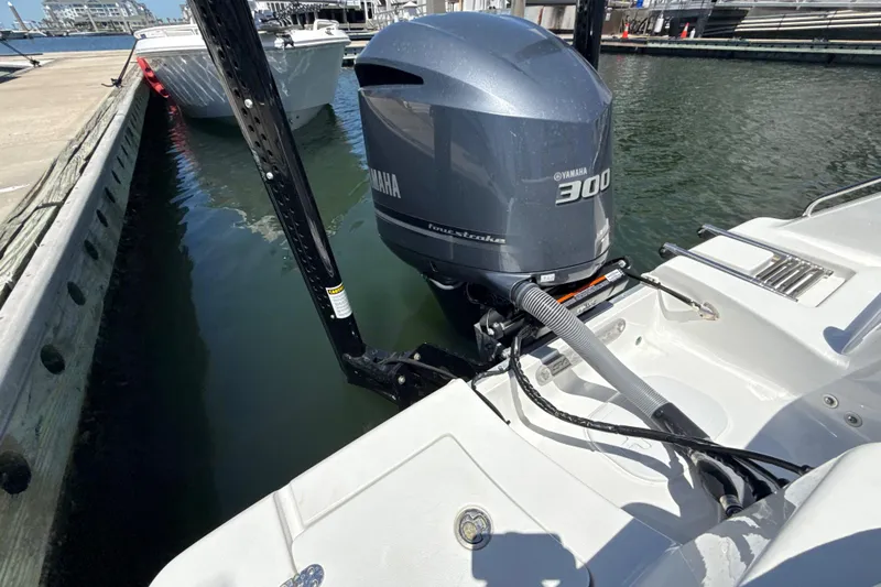 Slide: The Image of 2021 Sea Hunt Ultra 239 SE with Yamaha 300 engine docked at marina. - 19