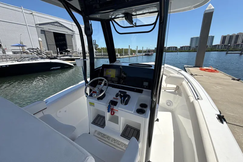 Slide: The Image of 2021 Sea Hunt Ultra 239 SE boat interior at marina dock. - 3