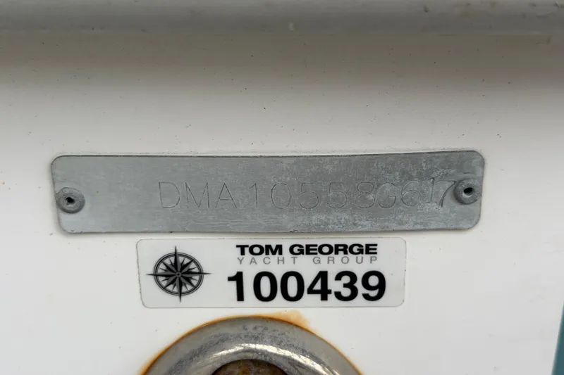 Slide: The Image of 2017 Edgewater 368CC boat identification plate with Tom George Yacht Group label. - 18
