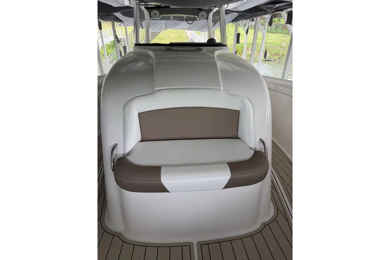 Slide: The Image of 2017 Edgewater 368CC boat interior with cushioned seating and sleek design. - 9