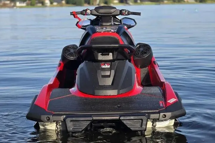 Slide: The Image of 2026 Yamaha WaveRunner VX Cruiser on calm water, showcasing sleek design and vibrant red accents. - 12