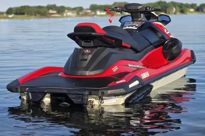 Slide: The Image of 2026 Yamaha WaveRunner VX Cruiser on calm lake waters, showcasing sleek design and vibrant colors. - 13