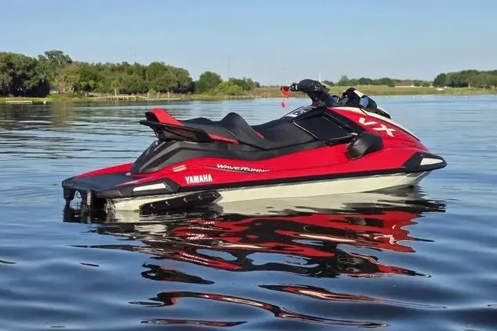 Slide: The Image of 2026 Yamaha WaveRunner VX Cruiser on a calm lake, showcasing sleek red design. - 14