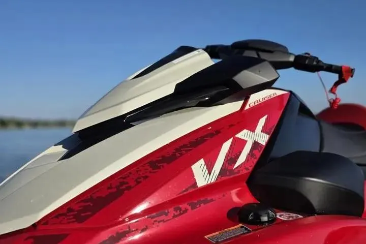 Slide: The Image of 2026 Yamaha WaveRunner VX Cruiser in red, close-up view on a sunny day. - 19