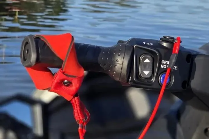 Slide: The Image of Close-up of 2026 Yamaha WaveRunner VX Cruiser handlebar with controls and safety lanyard. - 22