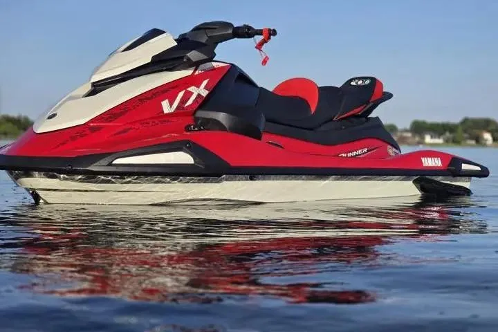 Slide: The Image of 2026 Yamaha WaveRunner VX Cruiser on calm water, showcasing sleek red and white design. - 3