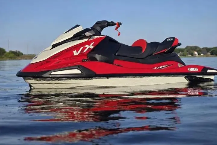 Slide: The Image of 2026 Yamaha WaveRunner VX Cruiser on calm water, showcasing sleek red and white design. - 5