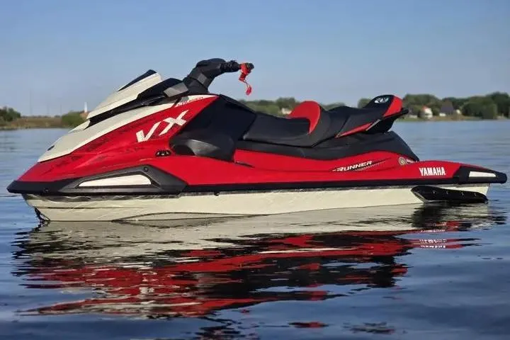 Slide: The Image of 2026 Yamaha WaveRunner VX Cruiser on calm water, showcasing sleek red and white design. - 6