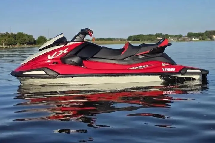 Slide: The Image of 2026 Yamaha WaveRunner VX Cruiser on calm water, showcasing sleek red and white design. - 7