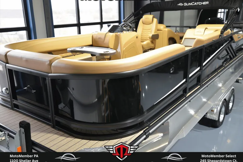 The Image of 2025 SunCatcher Fusion 324SS pontoon boat with luxurious tan seating and sleek black exterior. - 0
