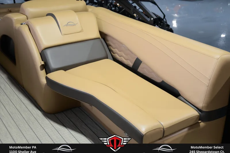 Slide: The Image of Luxurious seating in the 2025 SunCatcher Fusion 324SS boat, featuring tan and gray upholstery. - 10
