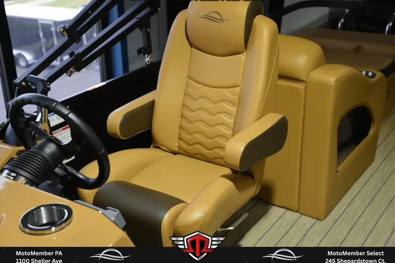 Slide: The Image of Luxurious tan captain's chair in 2025 SunCatcher Fusion 324SS boat cockpit. - 12