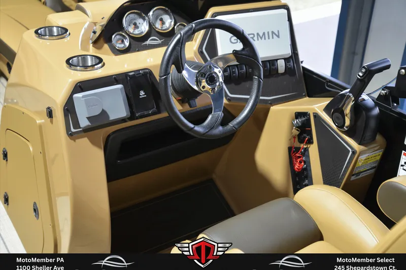 Slide: The Image of 2025 SunCatcher Fusion 324SS boat dashboard with Garmin navigation and modern controls. - 13