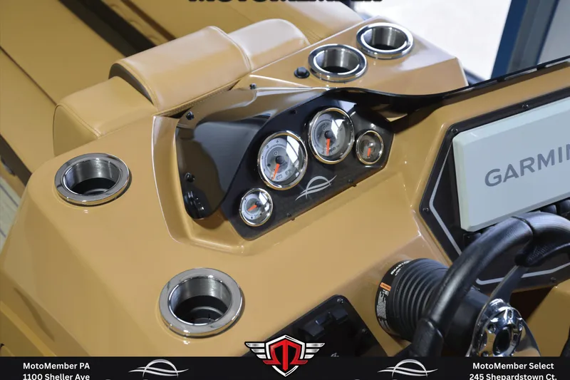 Slide: The Image of 2025 SunCatcher Fusion 324SS dashboard with gauges and Garmin display. - 14
