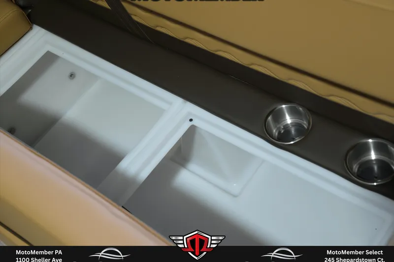 Slide: The Image of 2025 SunCatcher Fusion 324SS boat interior with storage compartments and cup holders. - 18