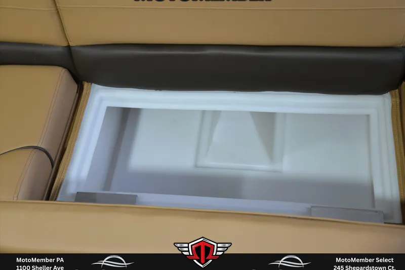 Slide: The Image of Storage compartment in 2025 SunCatcher Fusion 324SS boat, featuring tan and black seating. - 19