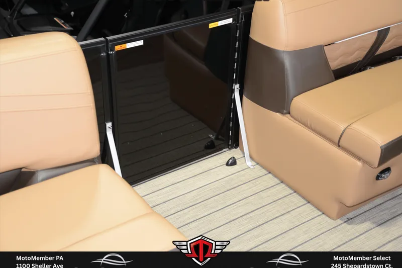 Slide: The Image of Interior seating of 2025 SunCatcher Fusion 324SS boat with tan upholstery and sleek design. - 22