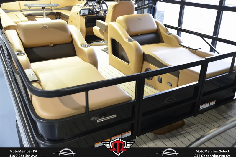 Slide: The Image of Luxurious SunCatcher Fusion 324SS pontoon boat interior, featuring plush tan seating and modern dashboard. - 4