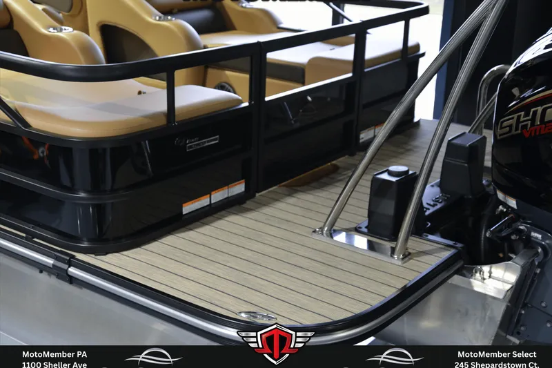 Slide: The Image of 2025 SunCatcher Fusion 324SS boat interior with tan seating and sleek black railing. - 5