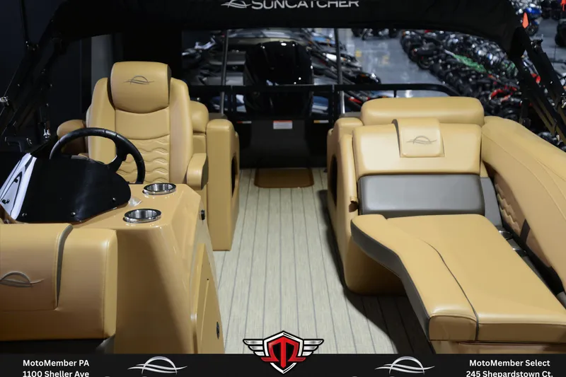 Slide: The Image of Interior of 2025 SunCatcher Fusion 324SS boat with tan seating and steering console. - 9