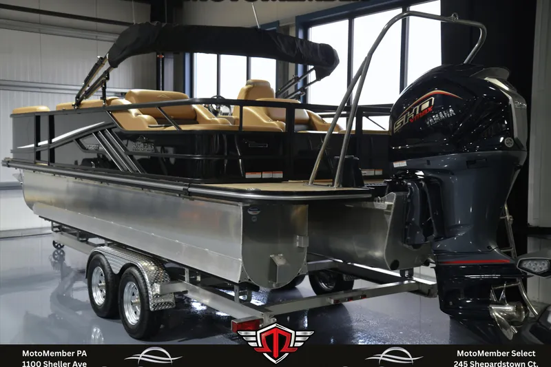 Slide: The Image of 2025 SunCatcher Fusion 324SS pontoon boat with Yamaha outboard motor on trailer. - 2