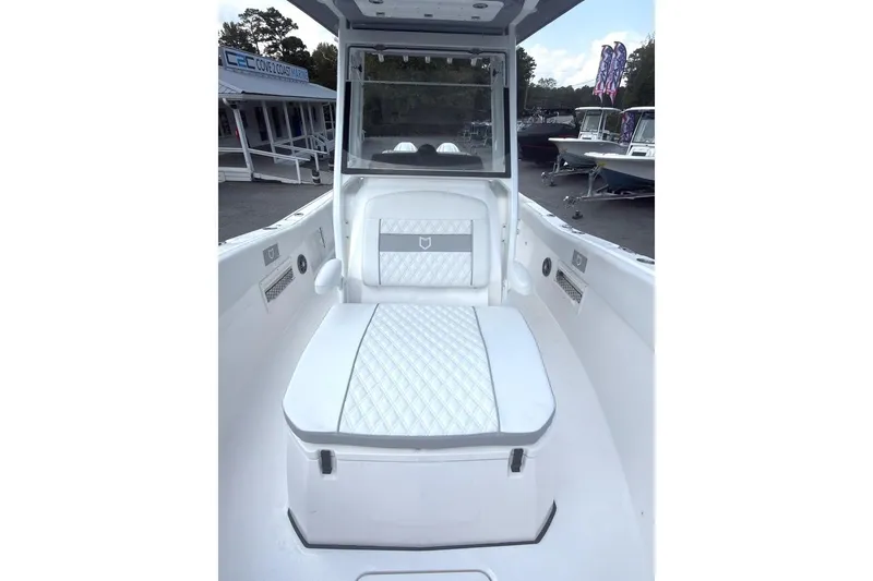 Slide: The Image of 2026 Sea Fox 268 Commander boat interior with white cushioned seating. - 10
