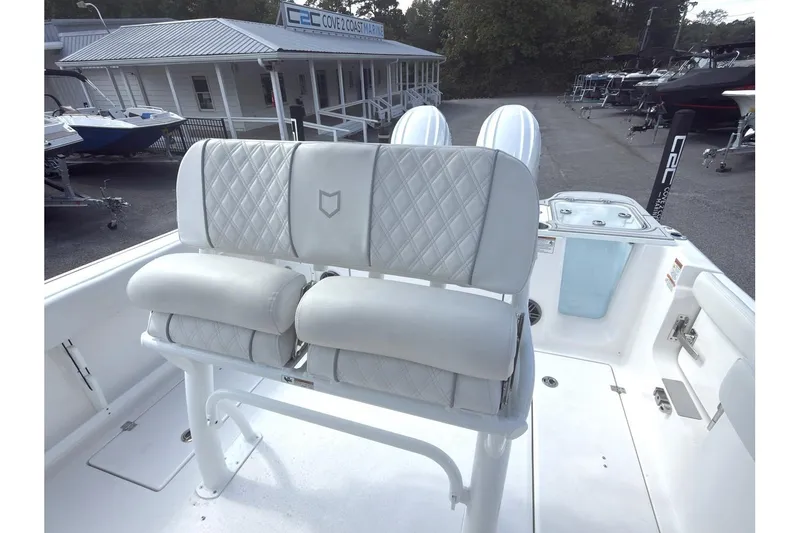 Slide: The Image of 2026 Sea Fox 268 Commander boat interior with cushioned seating and marine equipment. - 13