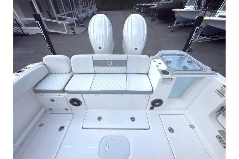 Slide: The Image of 2026 Sea Fox 268 Commander boat interior with seating and dual engines. - 14
