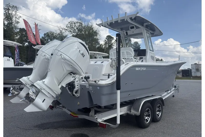 Slide: The Image of 2026 Sea Fox 268 Commander boat with dual Yamaha engines on a trailer. - 15