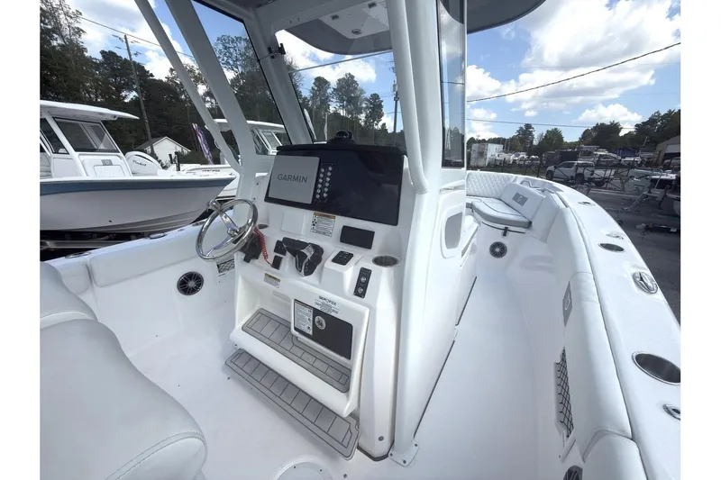 Slide: The Image of 2026 Sea Fox 268 Commander boat interior with Garmin navigation system and spacious seating. - 6