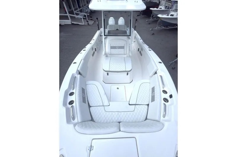 Slide: The Image of 2026 Sea Fox 268 Commander boat interior with white cushioned seating and sleek design. - 9