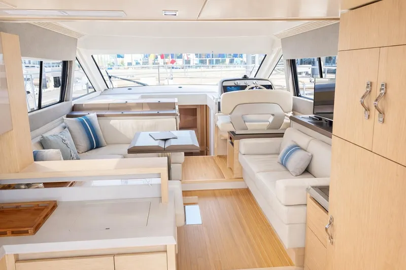 Slide: The Image of Luxurious interior of 2016 Beneteau Monte Carlo 5 yacht with modern furnishings and helm station. - 10