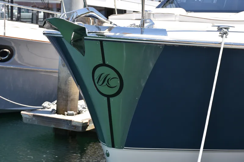 Slide: The Image of 2016 Beneteau Monte Carlo 5 yacht bow with logo, docked in marina. - 16