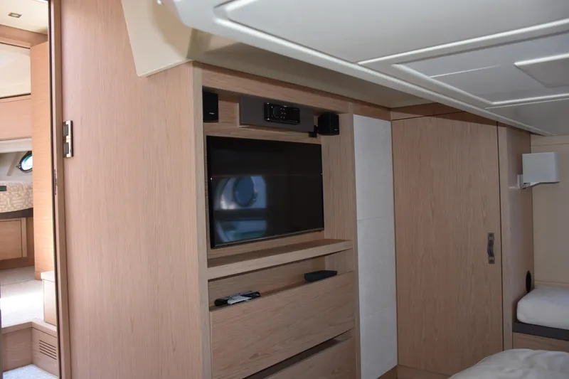 Slide: The Image of Interior of 2016 Beneteau Monte Carlo 5 yacht with modern wood finish and built-in TV. - 17