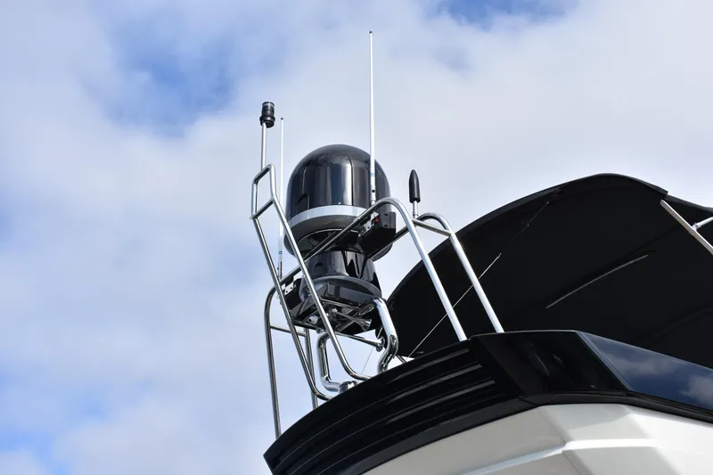 Slide: The Image of Radar equipment on a 2016 Beneteau Monte Carlo 5 yacht against a cloudy sky. - 22