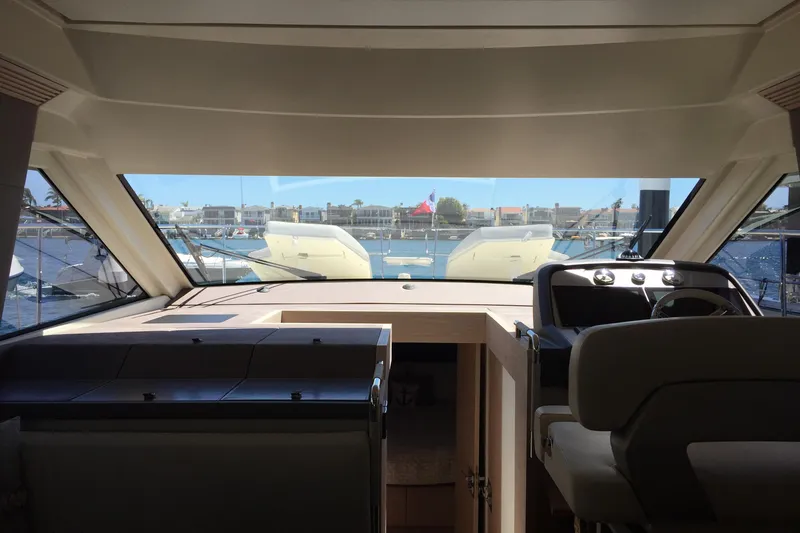 Slide: The Image of Interior view of 2016 Beneteau Monte Carlo 5 yacht cockpit with marina backdrop. - 30