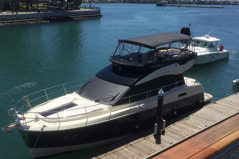 Slide: The Image of 2016 Beneteau Monte Carlo 5 yacht docked in a marina. - 31