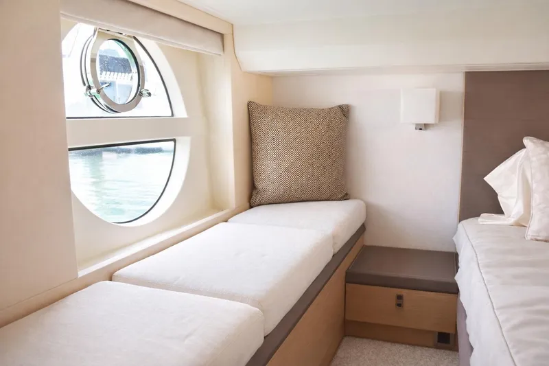 Slide: The Image of Luxurious interior of 2016 Beneteau Monte Carlo 5 yacht with elegant seating and window view. - 33