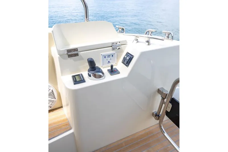 Slide: The Image of Control panel of 2016 Beneteau Monte Carlo 5 yacht with joystick and switches. - 39