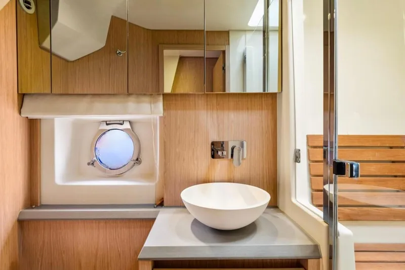 Slide: The Image of Luxurious bathroom interior of 2016 Beneteau Monte Carlo 5 yacht with modern fixtures. - 4