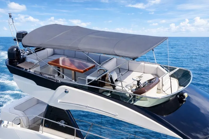 Slide: The Image of Luxurious 2016 Beneteau Monte Carlo 5 yacht with spacious flybridge and ocean backdrop. - 40