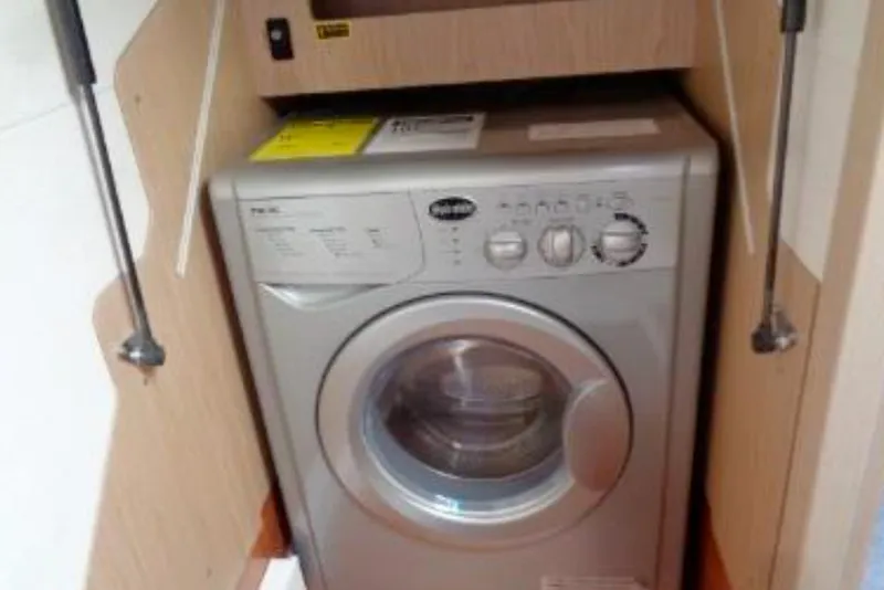 Slide: The Image of Washing machine inside 2016 Beneteau Monte Carlo 5 yacht's wooden cabinet. - 41
