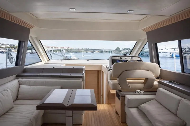 Slide: The Image of Luxurious interior of 2016 Beneteau Monte Carlo 5 yacht with elegant seating and helm. - 7