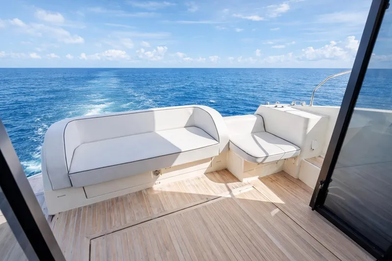Slide: The Image of Luxury seating on 2016 Beneteau Monte Carlo 5 yacht, overlooking ocean. - 8