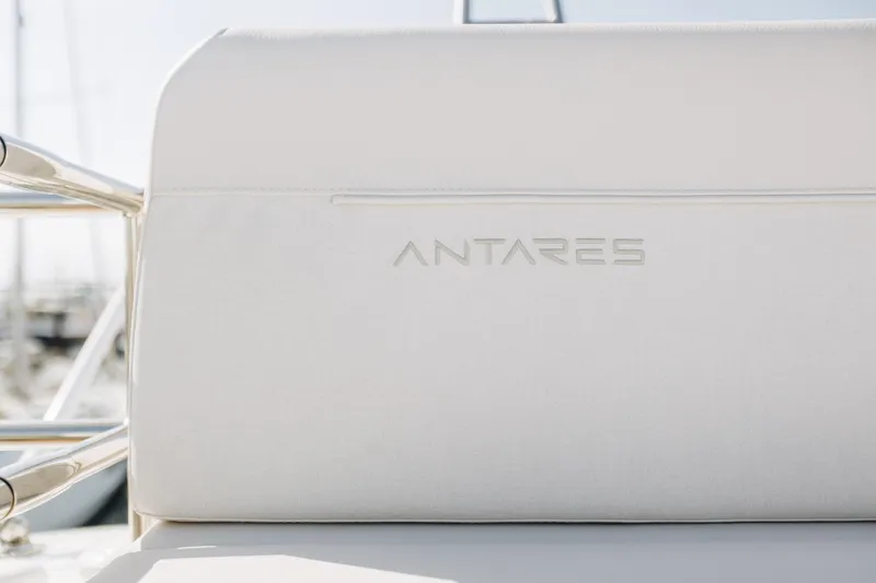 Slide: The Image of 2026 Beneteau Antares 12 Fly boat seat with embossed logo in bright sunlight. - 7