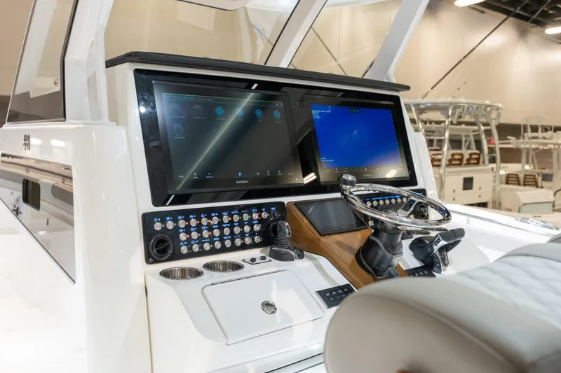 Slide: The Image of Caymas 401 DR 2027 boat console with modern displays and controls. - 11