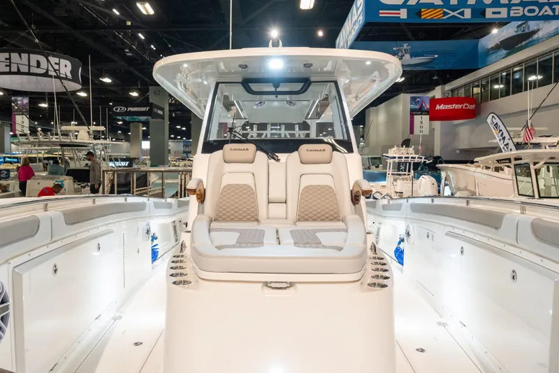 Slide: The Image of Caymas 401 DR 2027 displayed at a boat show. - 6