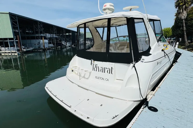 Slide: The Image of 2000 Cruisers Yachts 3575 Express docked at a marina, rear view. - 15