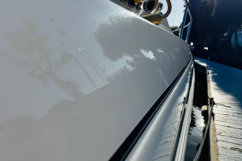 Slide: The Image of Side view of a 2000 Cruisers Yachts 3575 Express docked by the water. - 18